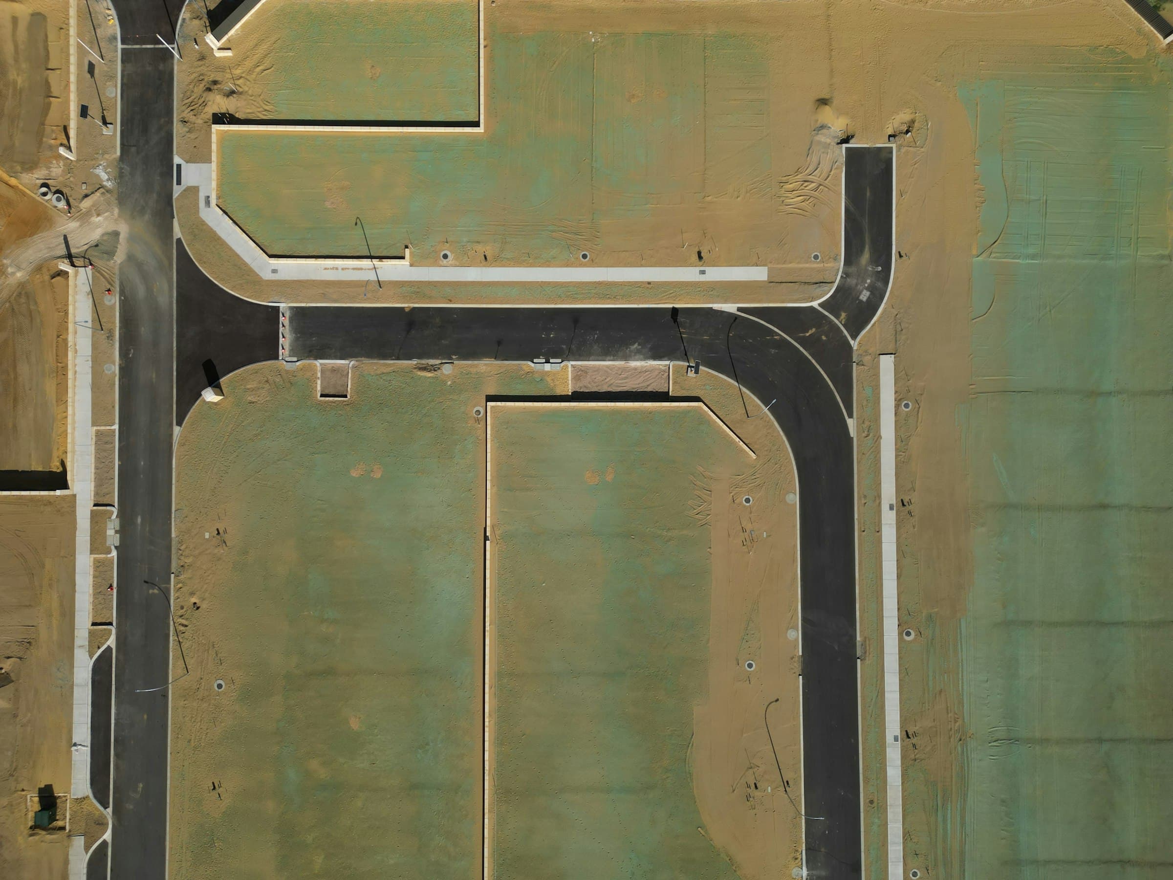Aerial view of raw land being subdivided and developed